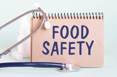 Gıda güvenliği, beyaz bir kağıt parçasına yazılan teşhis. Tedavi ve hastalıkların önlenmesi. Tıbbi konsept. Seçici odak