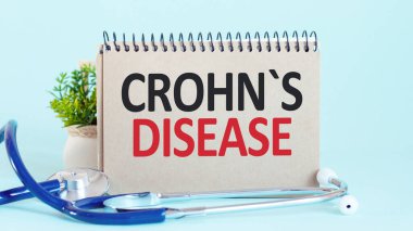 CROHN S DISEASE - diagnosis written on a white piece of paper. Treatment and prevention of disease. Medical concept. Selective focus clipart