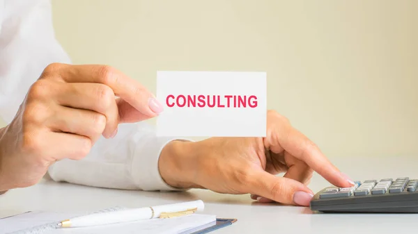 Consulting Inscription White Card Paper Sheet Hands Woman Red Letters — Stock Photo, Image