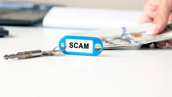 Word Scam Written Blue Keychain Key Office Desk Background Woman — Stock Photo, Image