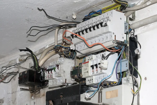 Cables hang out at an old control box — Stock Photo, Image