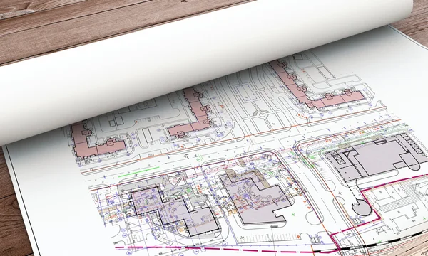 Le plan de construction roule sur la table — Photo