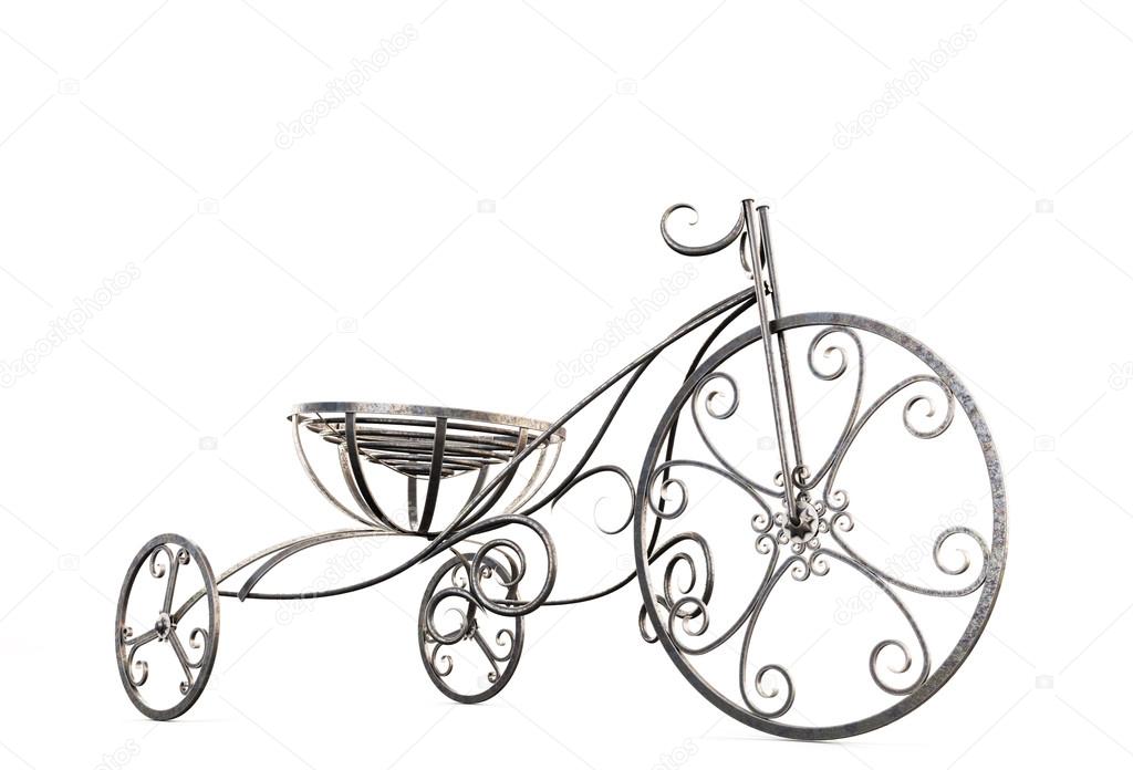 Small metal decorative tricycle close-up.
