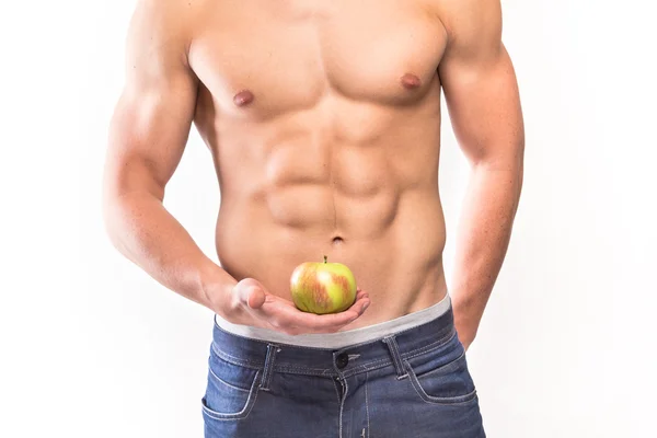 Torse musculaire homme avec pomme à portée de main — Photo