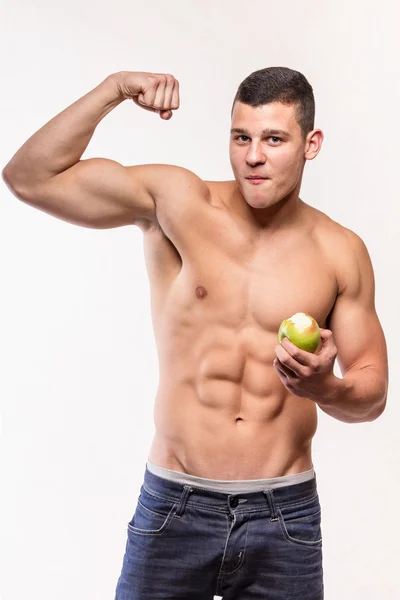 Mięśni fitness mężczyzna z apple ukazując biceps — Zdjęcie stockowe