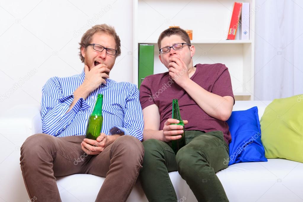 Two guys on boring party at home 