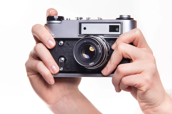 Classic 35mm photo camera in hand — Stock Photo, Image