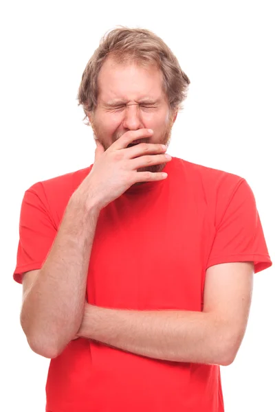 Bearded young man yawinig — Stock Photo, Image