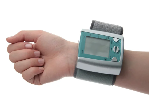 Electronic pressure gauge for measuring blood pressure on hand — Stock Photo, Image