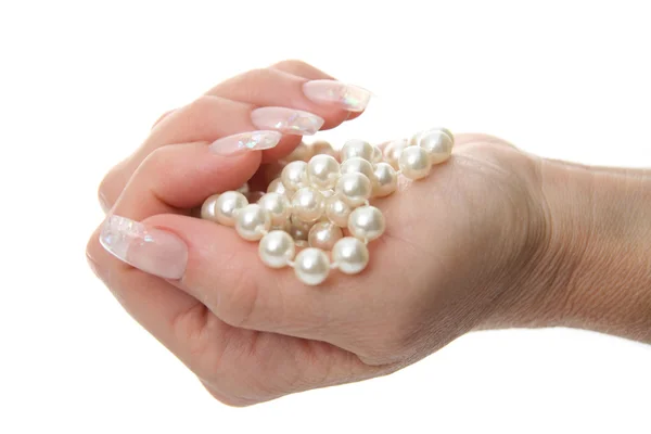 Woman hand holding pearl jewelery — Stock Photo, Image
