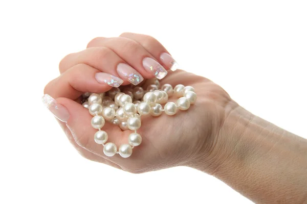 Woman hand holding pearl jewelery — Stock Photo, Image