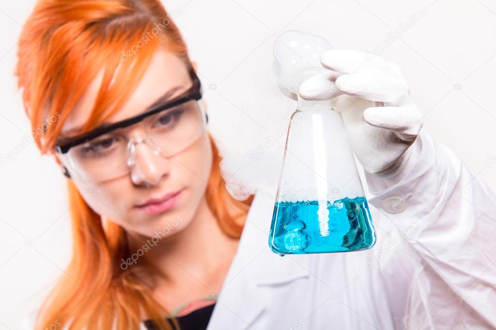 Chemist woman holding a test tube in a lab