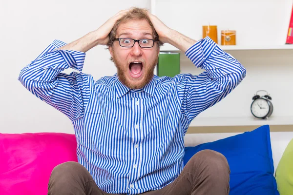 Shocked Man On The Couch — Stock Photo, Image