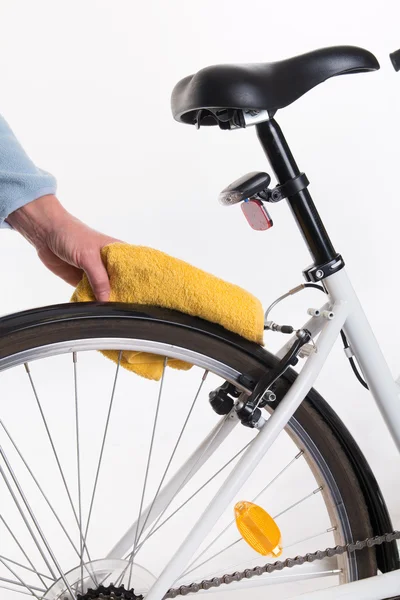 Hands with a cloth and water cleaning bicycle fender — Stock Photo, Image