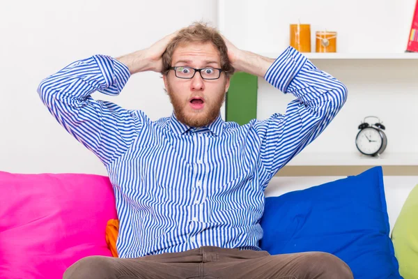 Shocked Man On The Couch — Stock Photo, Image