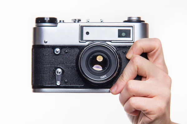 Classic 35mm photo camera in hand — Stock Photo, Image