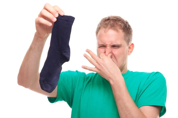 Man holding smelly sock — Stock Photo, Image