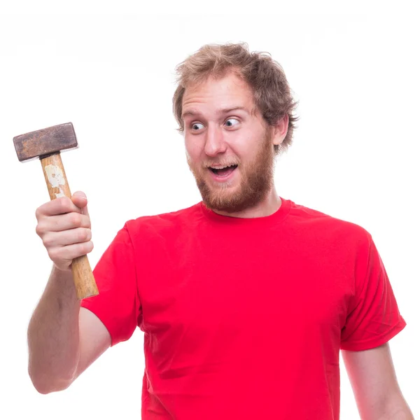 Homem surpreso segurando martelo — Fotografia de Stock