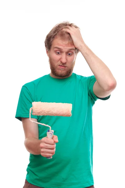 Man has a problem with painting with a roller — Stock Photo, Image