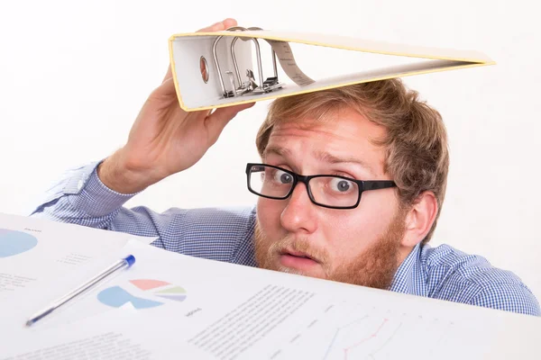 Frightened man under  the desk in the office — Stock Photo, Image