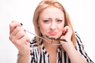 Disgusted woman eating insects clipart