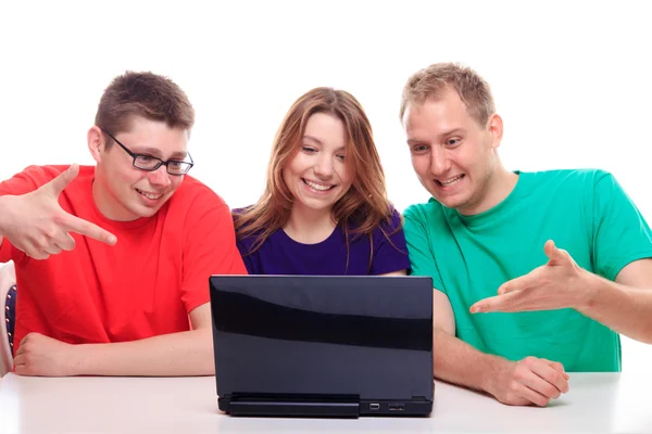 Friends sitting at laptop computer — Stock Photo, Image