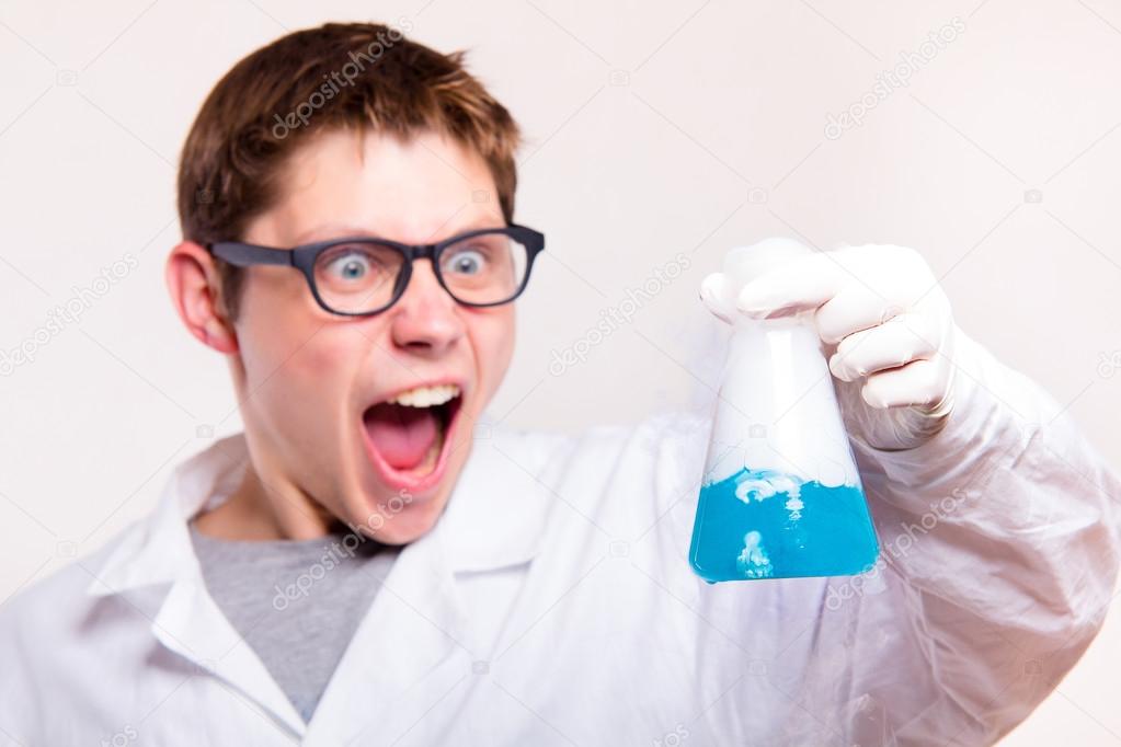 Surprised chemist holding test tube 