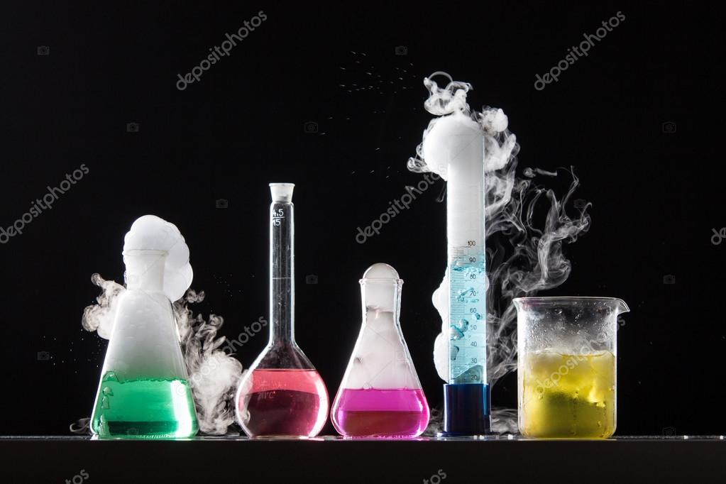 Chemical reactions in glasses in laboratory Stock Photo by