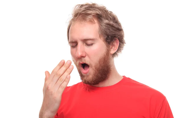 Bearded young man yawinig — Stock Photo, Image