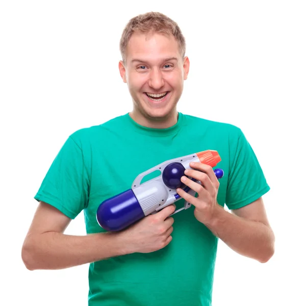 Young man with water gun — Stock Photo, Image
