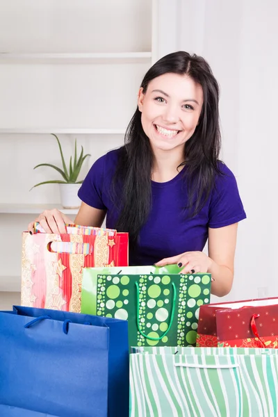 Girl preparing gifts for Christmas — Stock Photo, Image