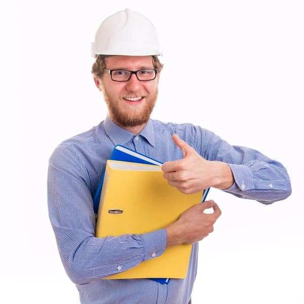 Молодой счастливый инженер в шлеме — стоковое фото
