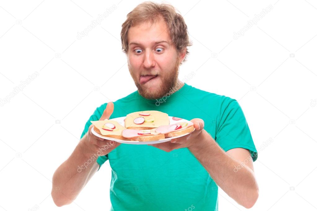 Man with plate of sandwiches