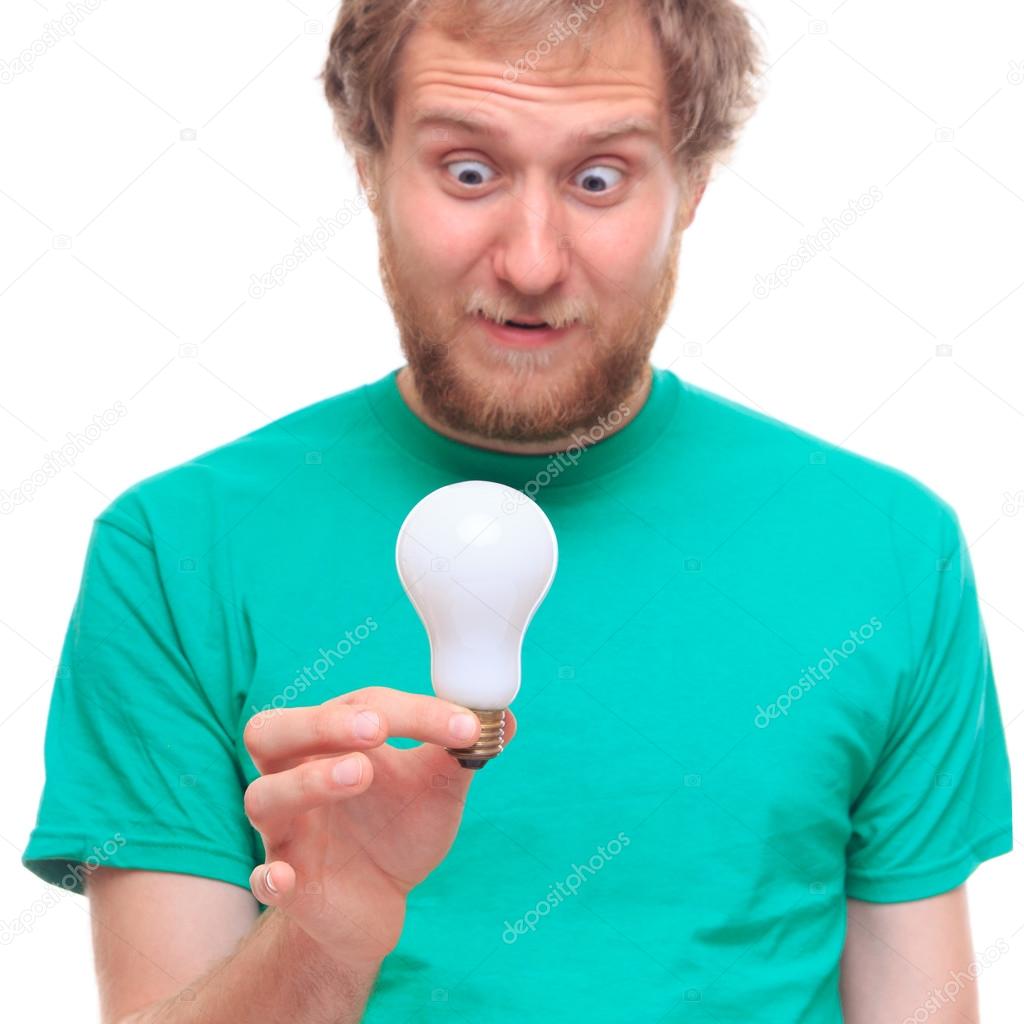 Surprised man holding  bulb