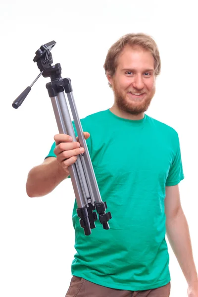 Man holding camera tripod — Stock Photo, Image