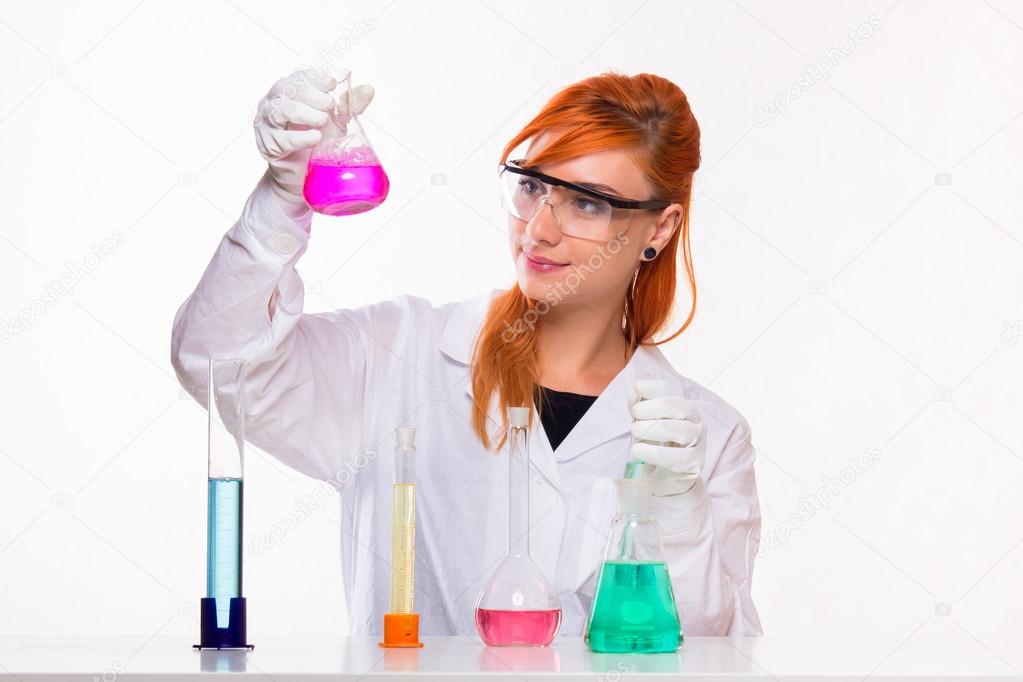 Student girl doing chemistry reactions