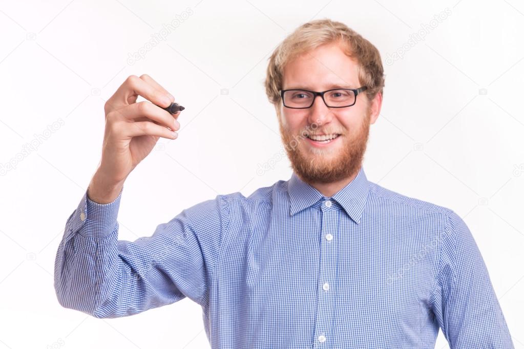 Young happy man writing on transparent board