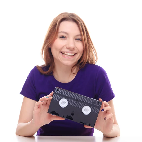 Young girl holding VHS tape — Stock Photo, Image