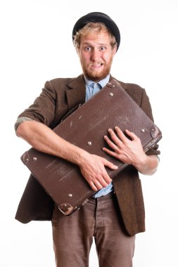 Terrified man in an old dress with a suitcase clipart