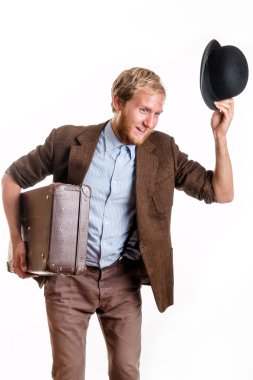 Bearded man in an old dress with a suitcase greets clipart