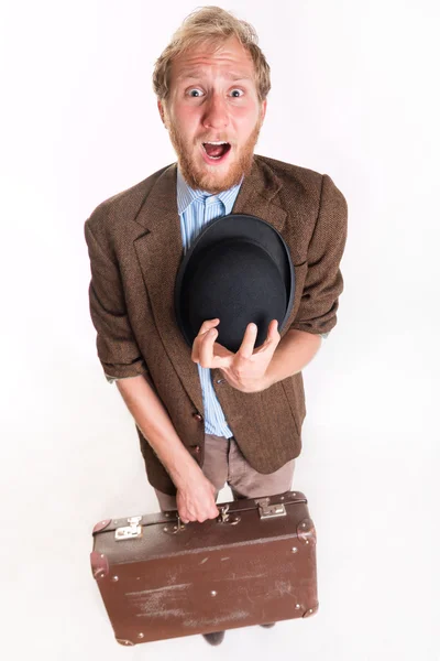 Lost terrified traveler man with a old suitcase — Stock Photo, Image