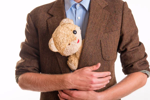 Old teddy bear in the arms of a man — Stock Photo, Image