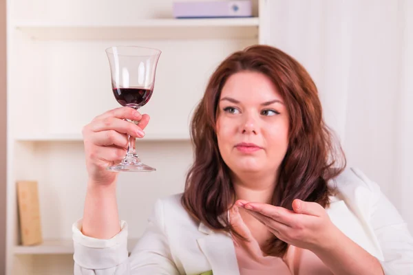 Elegant woman drinking wine — Stock Photo, Image