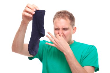 Man holding smelly sock clipart
