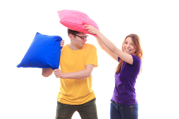 Boy and girl pillow fight