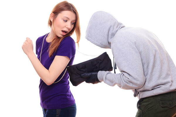 Thief stealing woman's purse