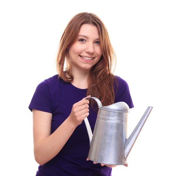 Young woman watering flowers — Stock Photo, Image