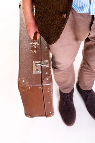 Legs of a man and suitcase in hand — Stock Photo, Image