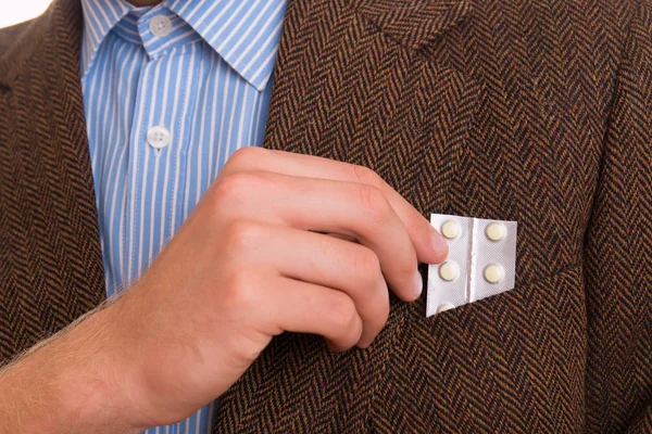 Medicamentos a la mano en el bolsillo —  Fotos de Stock