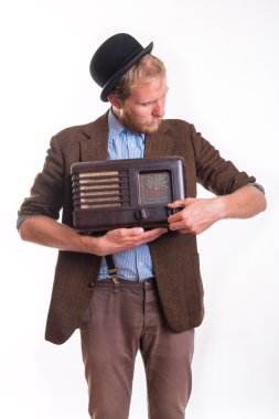 Old-fashioned man holding an old radio clipart